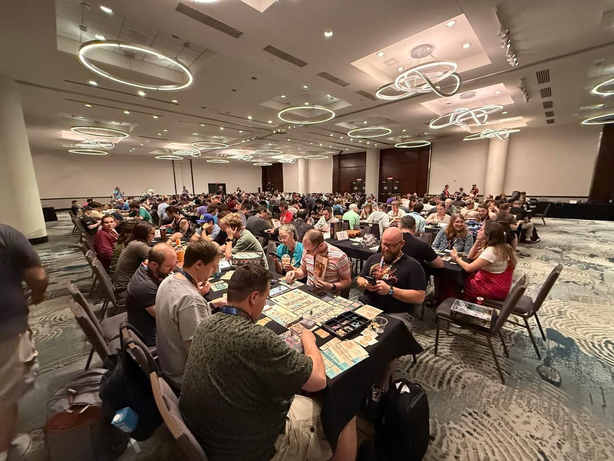Attendees playing a game at a community board game day
