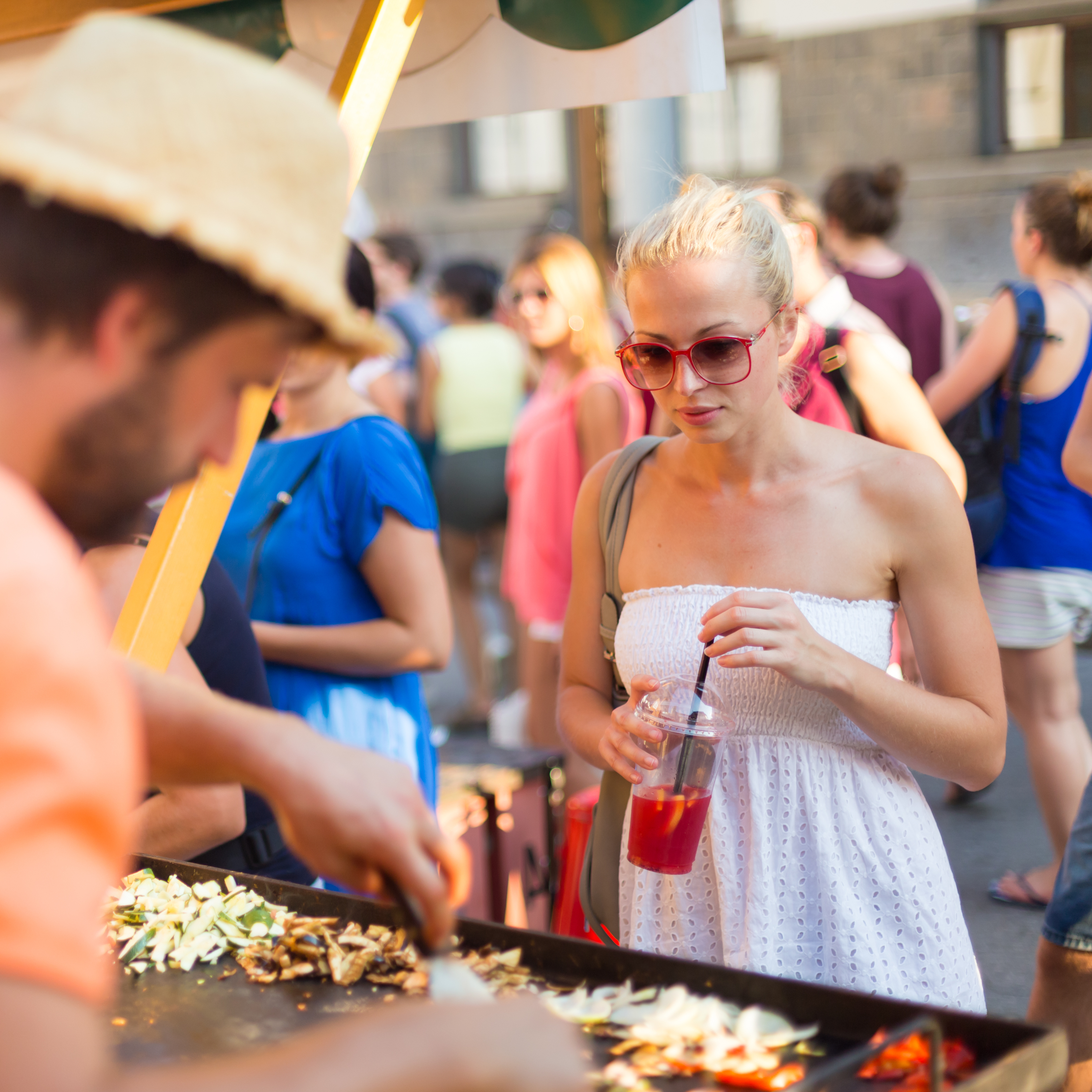 Street food market with vendors and visitors