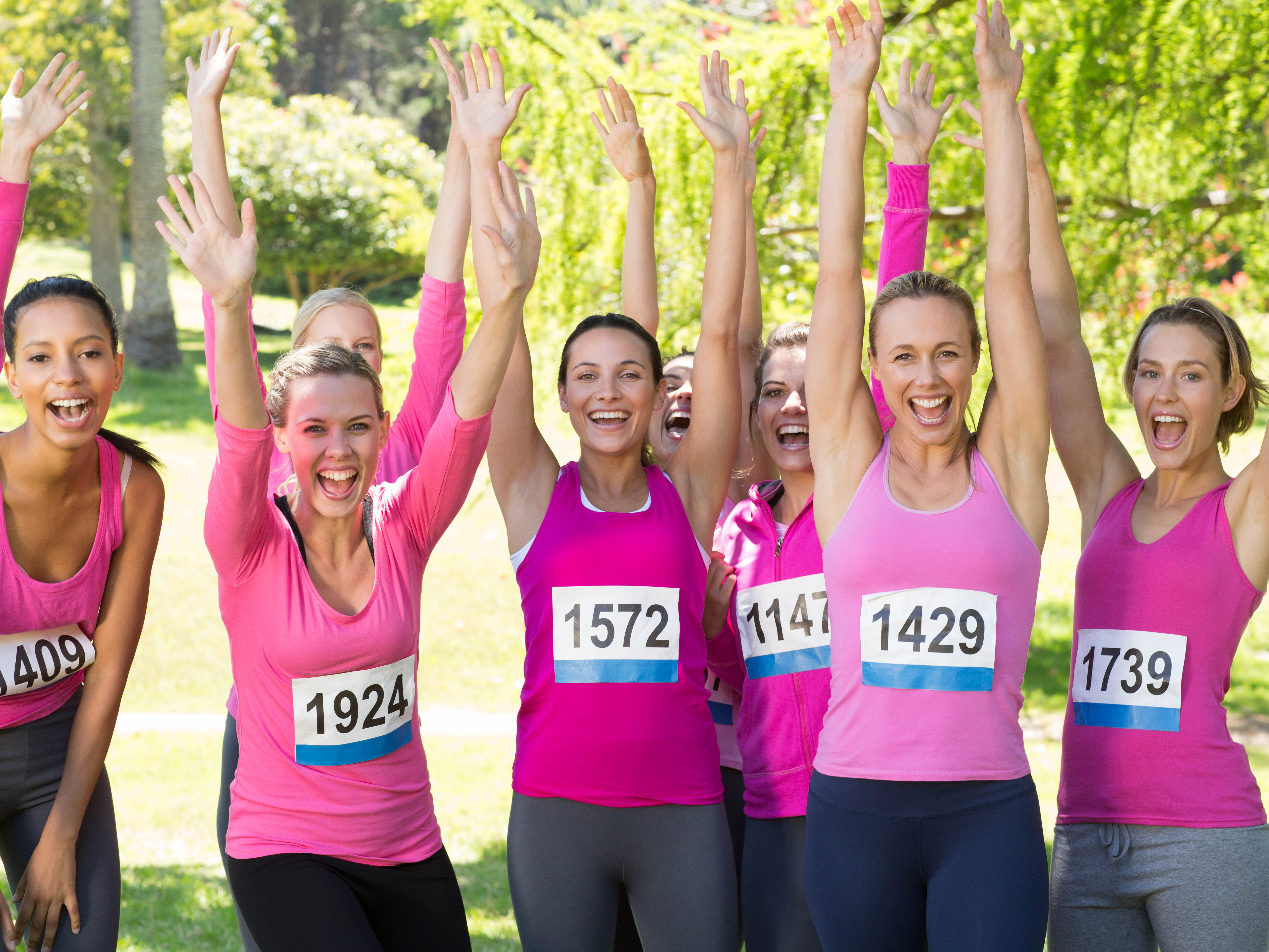 Charity walkers in pink at a community event