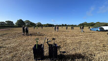 Detectorists_in_field_at_rally